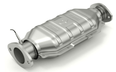 Image of a catalytic converter, showing the cylindrical metal device with pipes on both ends, used in a vehicle's exhaust system to reduce emissions.