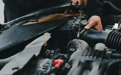 A skilled technician performing a car repair with precision and expertise, showcasing the commitment to excellence in automotive service.